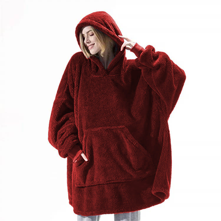 Person wearing oversized plush blanket hoodie