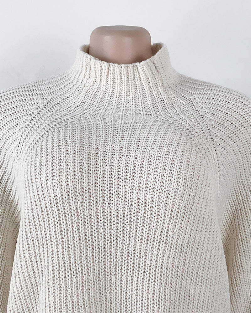 Woman in oversized turtleneck sweater dress