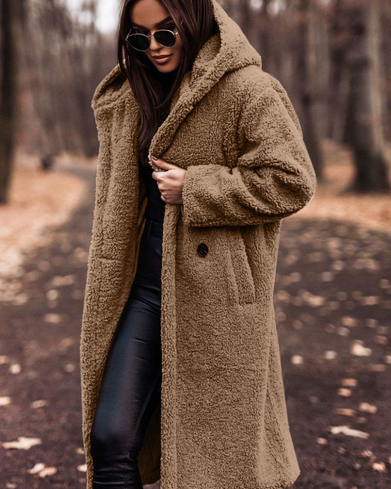 Woman in long hooded teddy coat