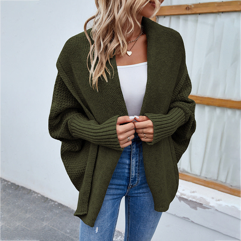Woman in oversized batwing knit cardigan