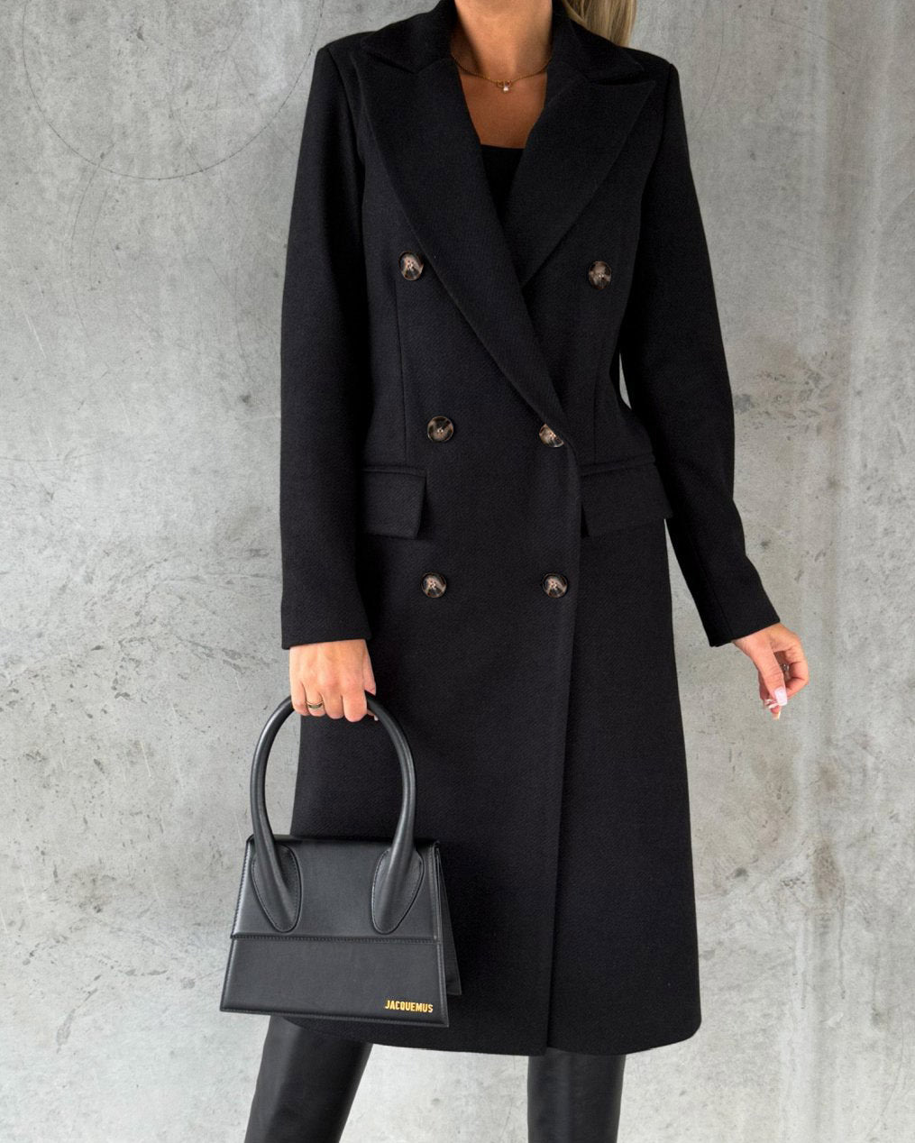 Woman in long double-breasted coat