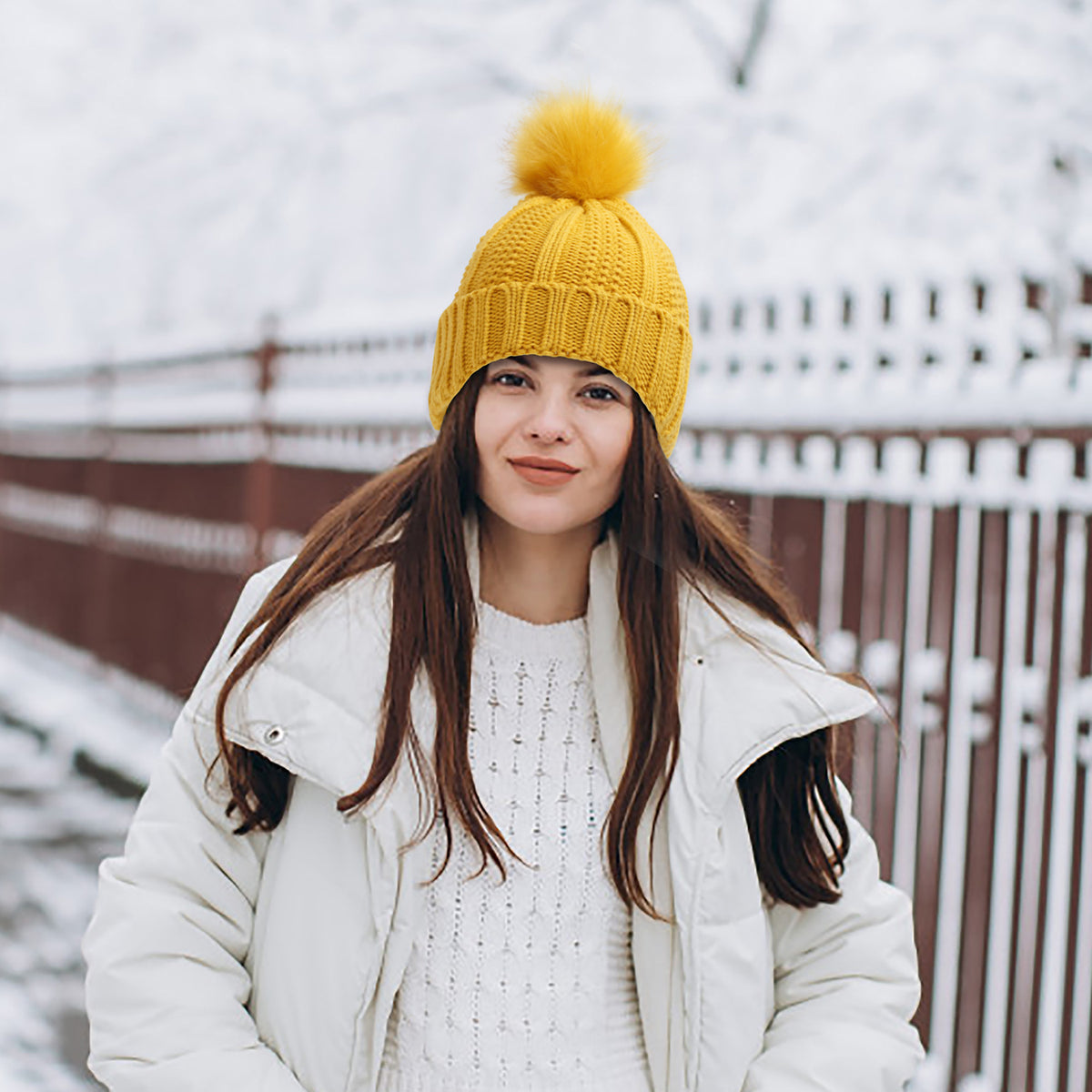 Knit beanie with faux fur pom pom